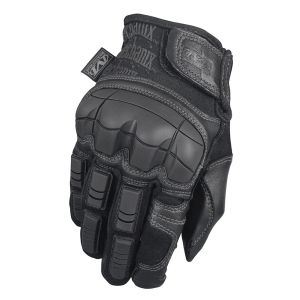 The image depicts the Mechanix Wear Breacher Gloves, focusing on the back of the hand. The gloves are predominantly black, featuring a moulded knuckle guard made from dense Thermoplastic Rubber (TPR) for superior impact protection. The material around the