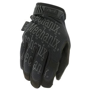 The image displays "The Original® Covert in Black" glove, featuring a close-up of the back of the glove. The glove showcases the distinctive "Mechanix Wear" branding in a grey print across a black background. The upper portion includes an adjustable Therm