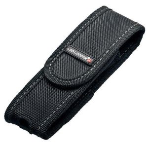 This image showcases the Ledlenser Pouch Type A in a closed position. The black nylon fabric is finely stitched, displaying durability. The brand's logo is prominently positioned in the centre on a velcro flap closure, indicating secure storage for the co