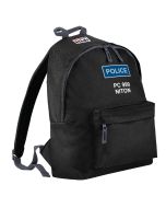 A durable black 'Police Kids Backpack' designed for children, with a vivid blue and white police patch prominently displayed on the top front. The patch reads 'POLICE' in bold white lettering with 'PC 999 NITON' underneath, mimicking UK police uniform ins
